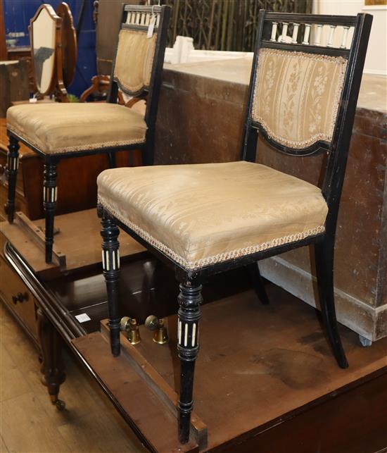 A pair of ebonised salon chairs